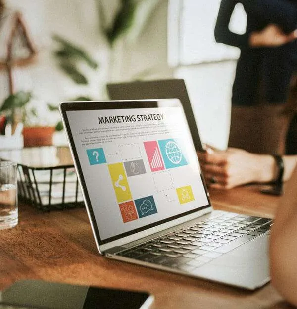 Laptop displaying a website for marketing strategy