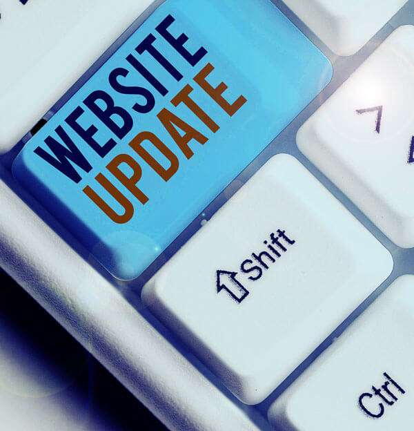 Keyboard with a big blue Website Update key.